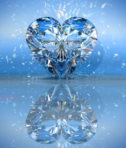 A heart shaped diamond on a blue background that represents manifesting love.